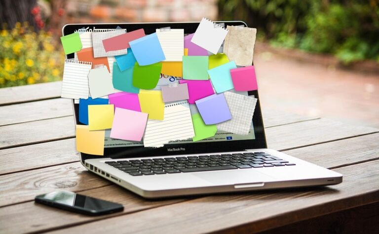 Laptop screen covered in sticky notes – representing a structured tech career strategy