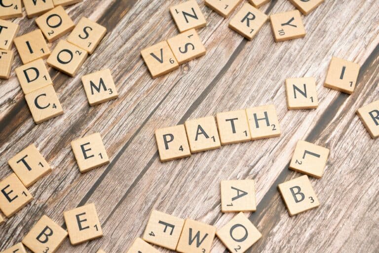 Scrabble tiles forming the word “path” on a table – symbolizing a tech career pivot
