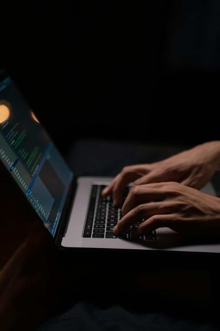 Side view of hands typing on a laptop – symbolizing online tech job search in 2025
